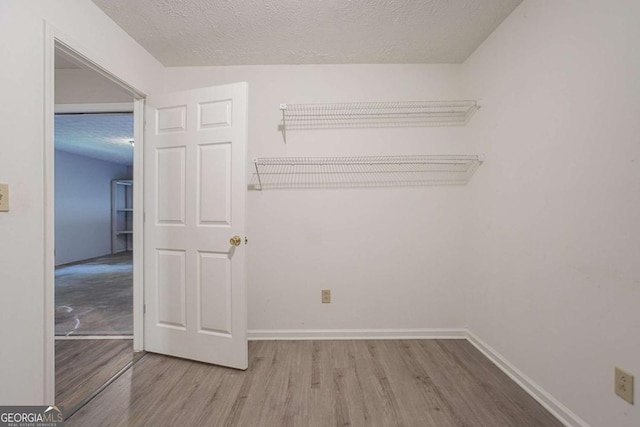2140 Deer Trl, Suwanee, GA 30024 - walk in closet with wood finished floors