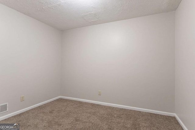 2140 Deer Trl, Suwanee, GA 30024 - empty room with carpet, baseboards, and a textured ceiling
