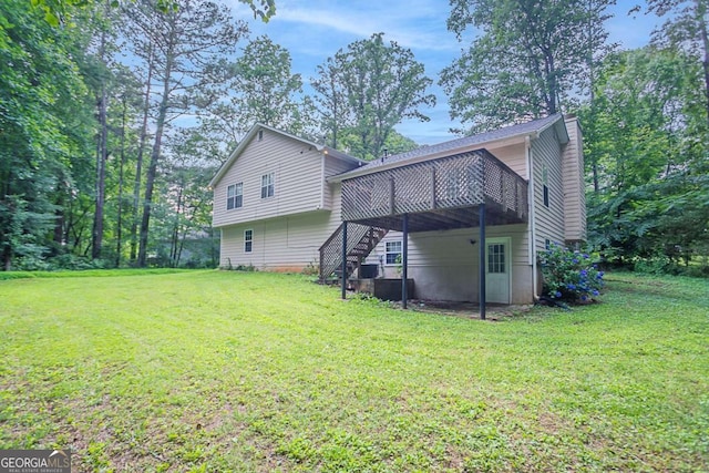 2140 Deer Trl, Suwanee, GA 30024 - rear view of house with a deck, stairs, a yard, and a chimney