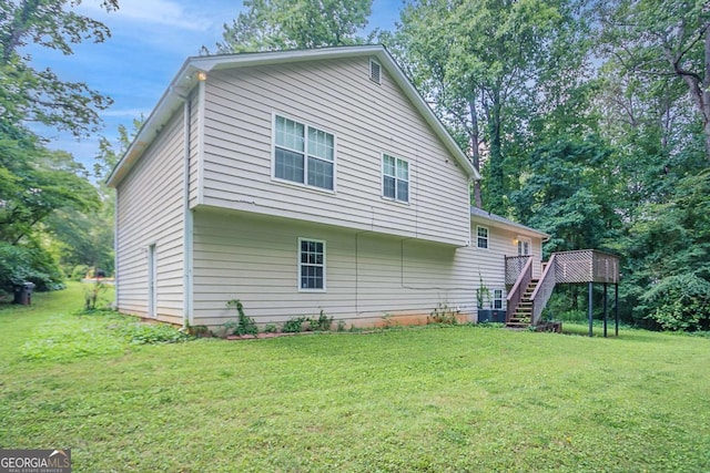 2140 Deer Trl, Suwanee, GA 30024 - back of property featuring stairway, a deck, and a lawn