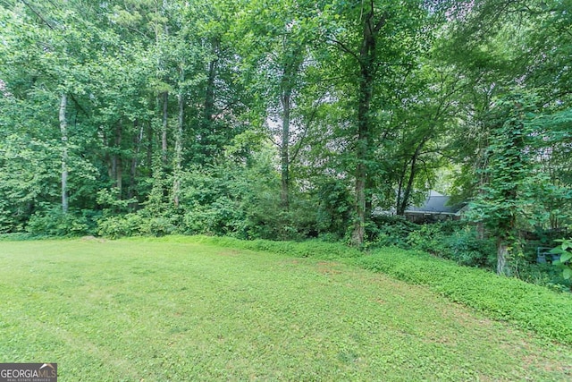 2140 Deer Trl, Suwanee, GA 30024 - view of green lawn with a wooded view