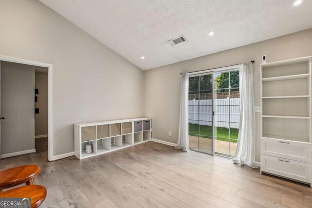 2657 Albion Farm Way, Duluth, GA 30097 - empty room with vaulted ceiling, wood finished floors, baseboards, and recessed lighting