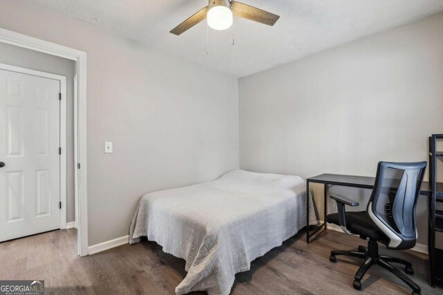 2657 Albion Farm Way, Duluth, GA 30097 - bedroom with wood finished floors, baseboards, and a ceiling fan