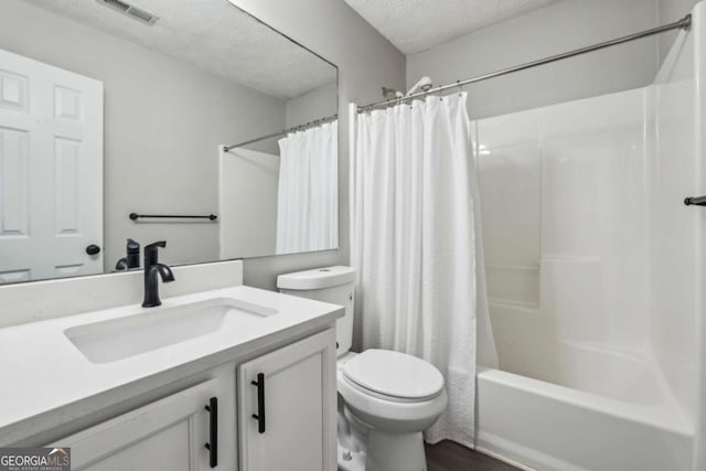 2657 Albion Farm Way, Duluth, GA 30097 - bathroom featuring vanity, shower / bathtub combination with curtain, and a textured ceiling