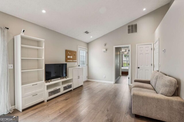 2657 Albion Farm Way, Duluth, GA 30097 - living area with light wood-style floors, baseboards, recessed lighting, and high vaulted ceiling