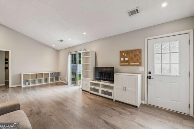 2657 Albion Farm Way, Duluth, GA 30097 - unfurnished living room featuring hardwood / wood-style floors, vaulted ceiling, and recessed lighting