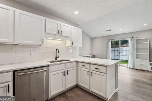 2657 Albion Farm Way, Duluth, GA 30097 - kitchen featuring dishwasher, a sink, a peninsula, tasteful backsplash, and white cabinets