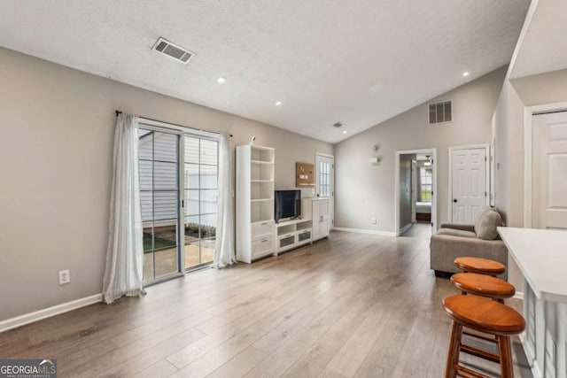 2657 Albion Farm Way, Duluth, GA 30097 - living area featuring wood finished floors, recessed lighting, and high vaulted ceiling