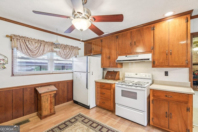 289 Hilton St, Monticello, GA 31064 - kitchen featuring extractor fan, white appliances, light wood finished floors, a ceiling fan, and brown cabinets
