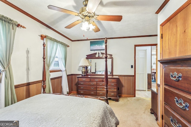 289 Hilton St, Monticello, GA 31064 - bedroom with wainscoting, wood walls, light colored carpet, ornamental molding, and a textured ceiling