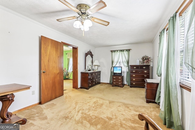 289 Hilton St, Monticello, GA 31064 - carpeted bedroom with ornamental molding, ceiling fan, a textured ceiling, and baseboards