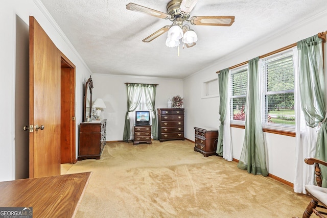 289 Hilton St, Monticello, GA 31064 - bedroom featuring light colored carpet, crown molding, a textured ceiling, baseboards, and a ceiling fan