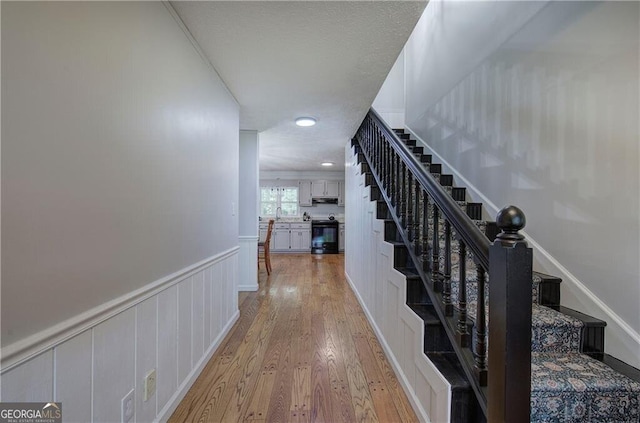 141 Holcomb Spur NW, Adairsville, GA 30103 - stairs featuring wood finished floors, wainscoting, and recessed lighting