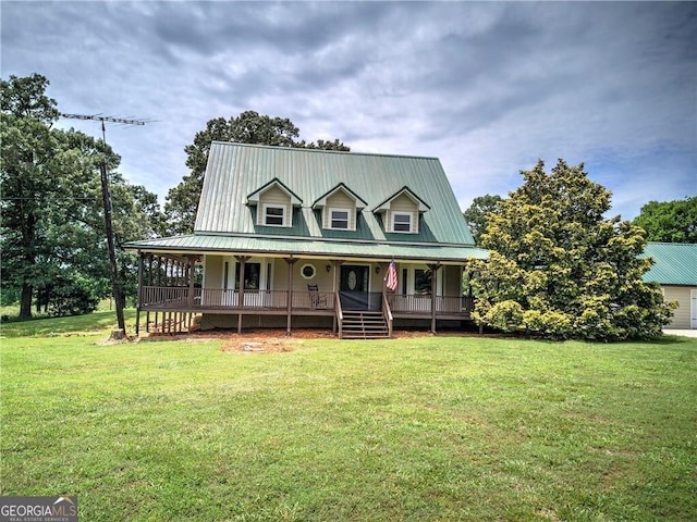 141 Holcomb Spur NW, Adairsville, GA 30103 - farmhouse featuring covered porch, a front lawn, and a metal roof