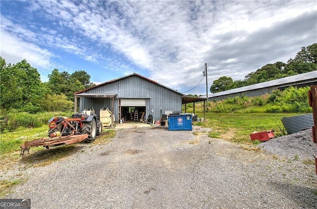 141 Holcomb Spur NW, Adairsville, GA 30103 - detached garage featuring gravel driveway