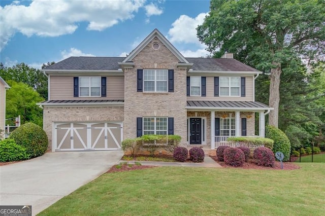 262 Sandhurst Ct, Suwanee, GA 30024 - view of front facade featuring a standing seam roof, driveway, an attached garage, and a front lawn