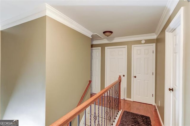 262 Sandhurst Ct, Suwanee, GA 30024 - corridor featuring wood finished floors, crown molding, an upstairs landing, and baseboards