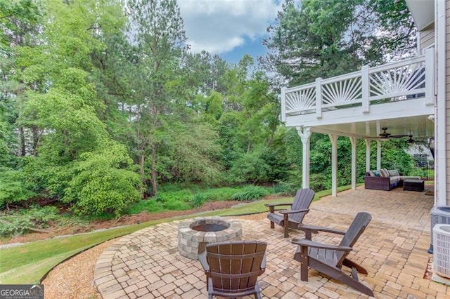 262 Sandhurst Ct, Suwanee, GA 30024 - view of patio / terrace with a balcony, an outdoor living space with a fire pit, and a ceiling fan