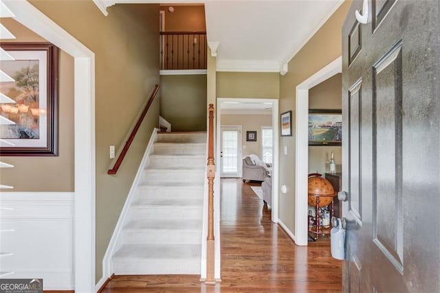 262 Sandhurst Ct, Suwanee, GA 30024 - foyer with ornamental molding, stairway, and wood finished floors