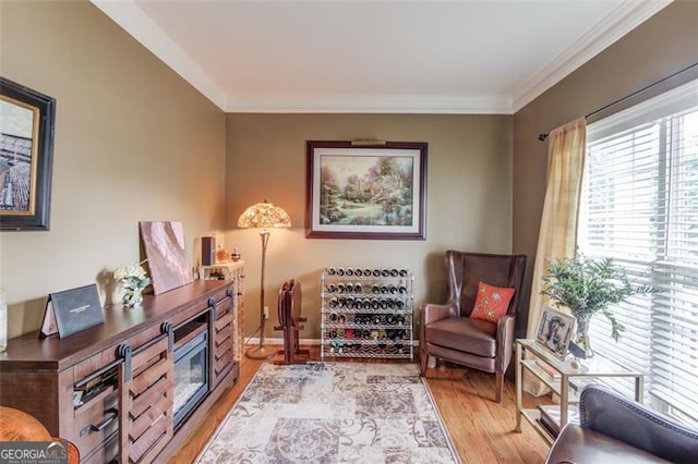 262 Sandhurst Ct, Suwanee, GA 30024 - sitting room with light wood finished floors and ornamental molding