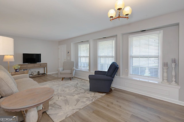 4814 Chesil Ave, Columbus, GA 31904 - living area with light wood finished floors and a chandelier