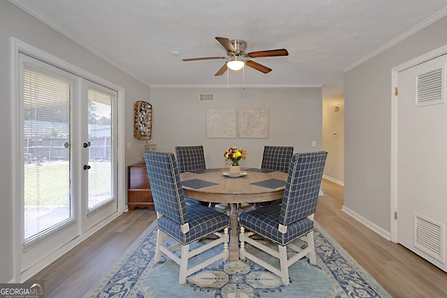 4814 Chesil Ave, Columbus, GA 31904 - dining room with light wood-style flooring, plenty of natural light, baseboards, and ornamental molding
