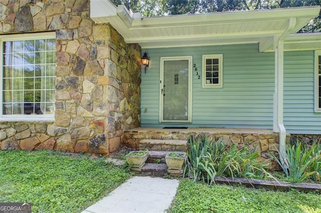 2612 Spring St, Dacula, GA 30019 - property entrance featuring stone siding and covered porch