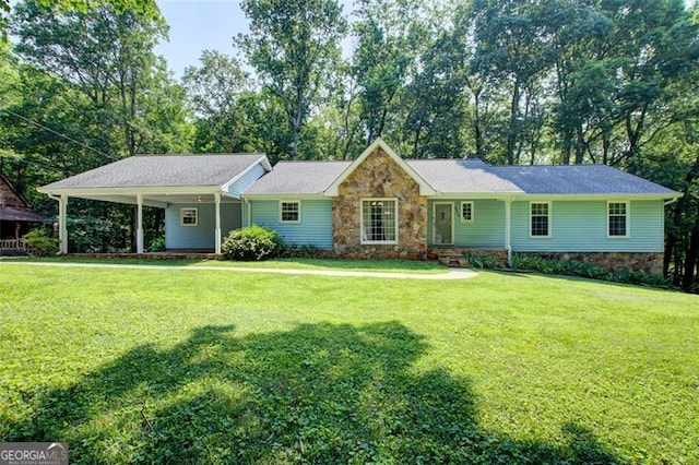2612 Spring St, Dacula, GA 30019 - single story home with a front yard, stone siding, and view of scattered trees