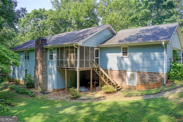 2612 Spring St, Dacula, GA 30019 - rear view of property with a sunroom, stairway, and a lawn