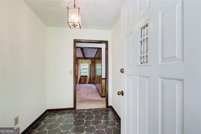 2612 Spring St, Dacula, GA 30019 - corridor featuring baseboards and dark colored carpet