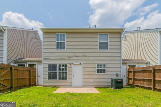 256 Turnstone Rd, Stockbridge, GA 30281 - rear view of property featuring a patio and a fenced backyard