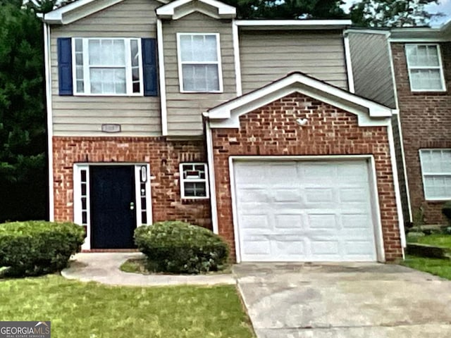 5057 Windsor Forrest Ln, Atlanta, GA 30349 - multi unit property with brick siding and concrete driveway