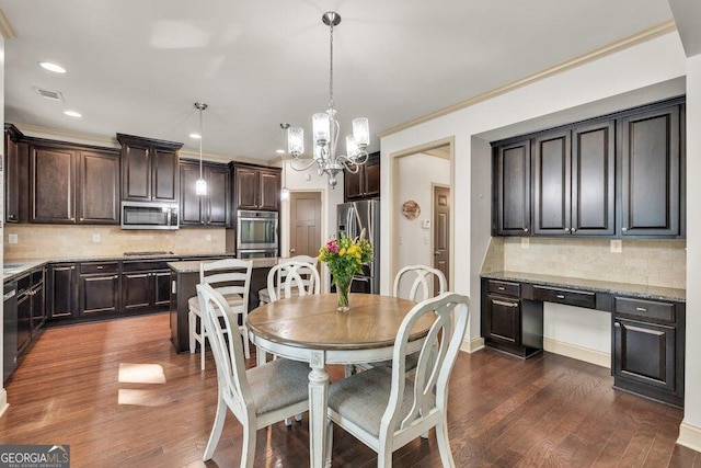 2525 Well Springs Dr, Buford, GA 30519 - dining room featuring recessed lighting, a chandelier, dark wood-style flooring, and ornamental molding