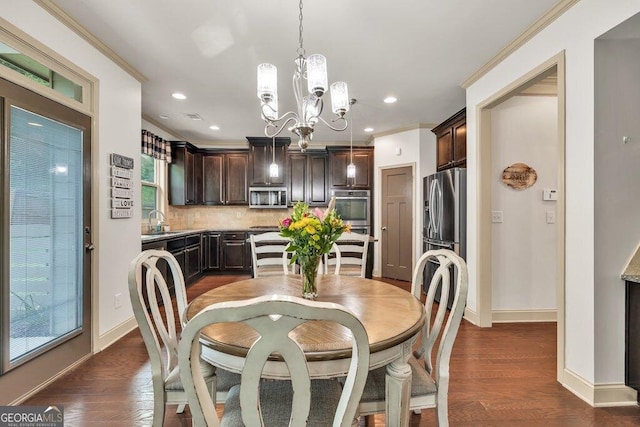 2525 Well Springs Dr, Buford, GA 30519 - dining area with a chandelier, crown molding, dark wood finished floors, and recessed lighting