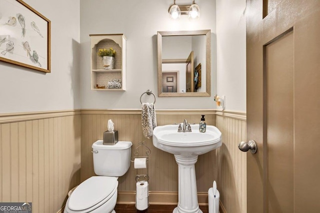 2525 Well Springs Dr, Buford, GA 30519 - half bath with a wainscoted wall and toilet