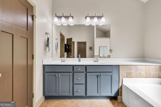 2525 Well Springs Dr, Buford, GA 30519 - bathroom featuring double vanity, a garden tub, and tile patterned floors