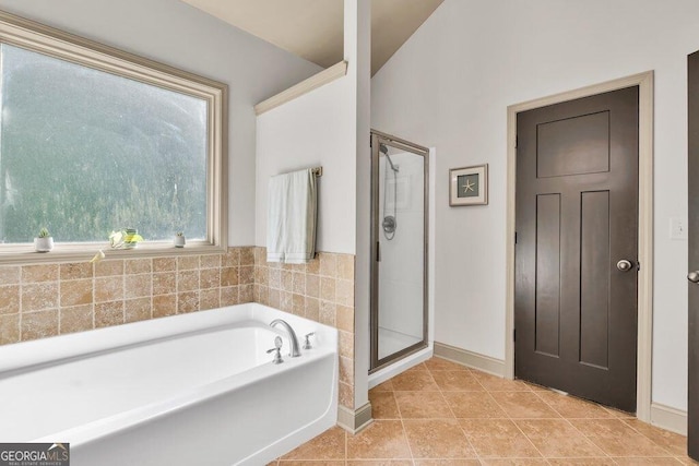 2525 Well Springs Dr, Buford, GA 30519 - bathroom featuring a bath, a stall shower, and tile patterned flooring