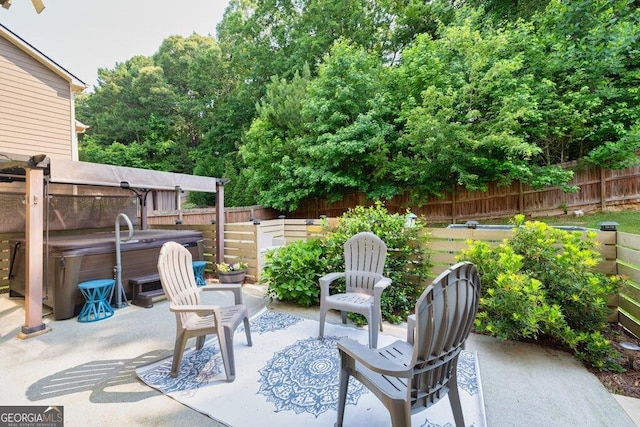 2525 Well Springs Dr, Buford, GA 30519 - fenced backyard with a hot tub and a patio