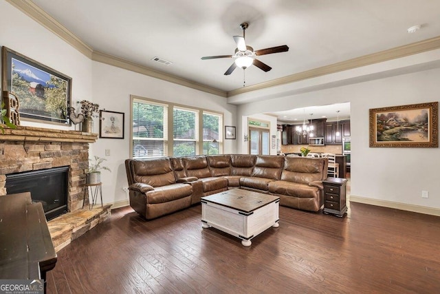 2525 Well Springs Dr, Buford, GA 30519 - living room featuring ceiling fan, crown molding, dark wood-style floors, and a stone fireplace
