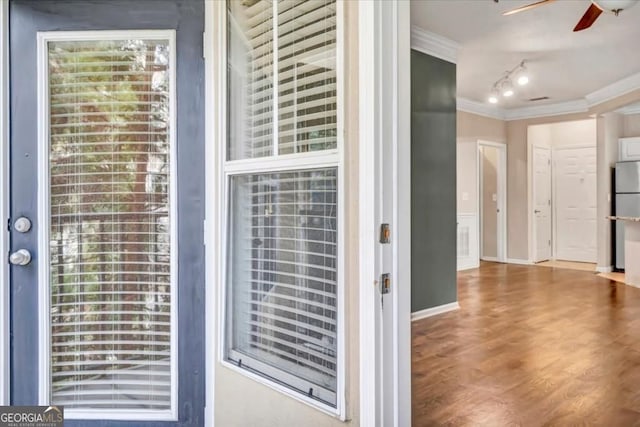 1850 Cotillion Dr Unit 3305, Dunwoody, GA 30338 - detailed view of ornamental molding, ceiling fan, wood finished floors, and freestanding refrigerator