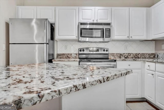 1850 Cotillion Dr Unit 3305, Dunwoody, GA 30338 - kitchen featuring appliances with stainless steel finishes and white cabinets