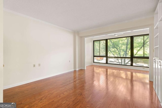 1800 Clairmont Lk Unit 216, Decatur, GA 30033 - unfurnished room with wood finished floors and ornamental molding