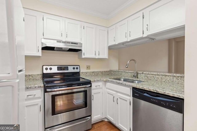 1800 Clairmont Lk Unit 216, Decatur, GA 30033 - kitchen featuring stainless steel appliances, under cabinet range hood, ornamental molding, and white cabinets