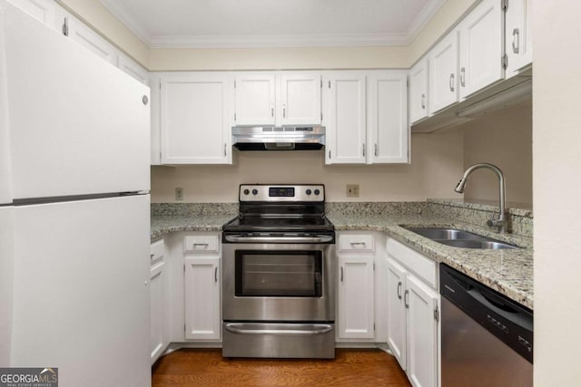 1800 Clairmont Lk Unit 216, Decatur, GA 30033 - kitchen with appliances with stainless steel finishes, range hood, white cabinets, ornamental molding, and light stone counters