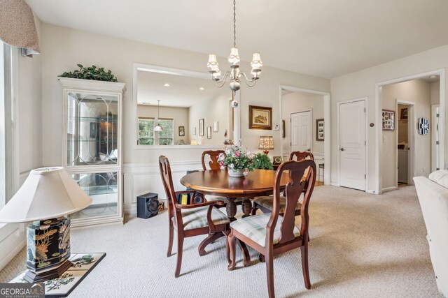 5105 Kings Common Way, Cumming, GA 30040 - dining space with light carpet and a chandelier