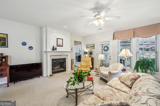 5105 Kings Common Way, Cumming, GA 30040 - living area featuring a fireplace, carpet, and ceiling fan