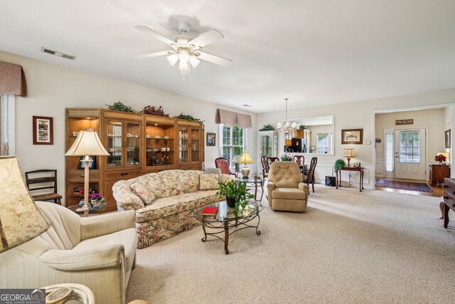 5105 Kings Common Way, Cumming, GA 30040 - living area with carpet, ceiling fan, and a chandelier