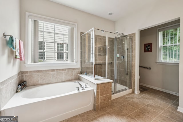 5105 Kings Common Way, Cumming, GA 30040 - bathroom with a garden tub, a stall shower, tile patterned floors, and toilet