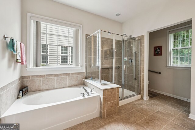 5105 Kings Common Way, Cumming, GA 30040 - bathroom with a garden tub, a stall shower, tile patterned floors, and toilet