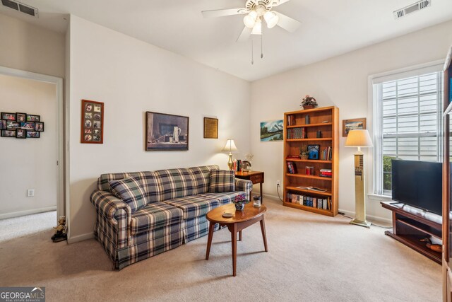 5105 Kings Common Way, Cumming, GA 30040 - living area featuring carpet floors, ceiling fan, and baseboards